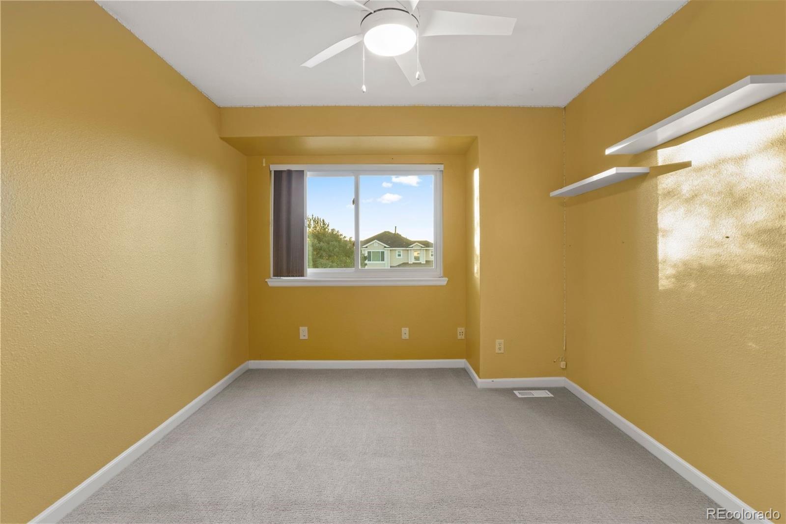 5426 East Knoll Place Highlands Ranch, CO 80130 - Photo 24 of 28 an empty room with windows