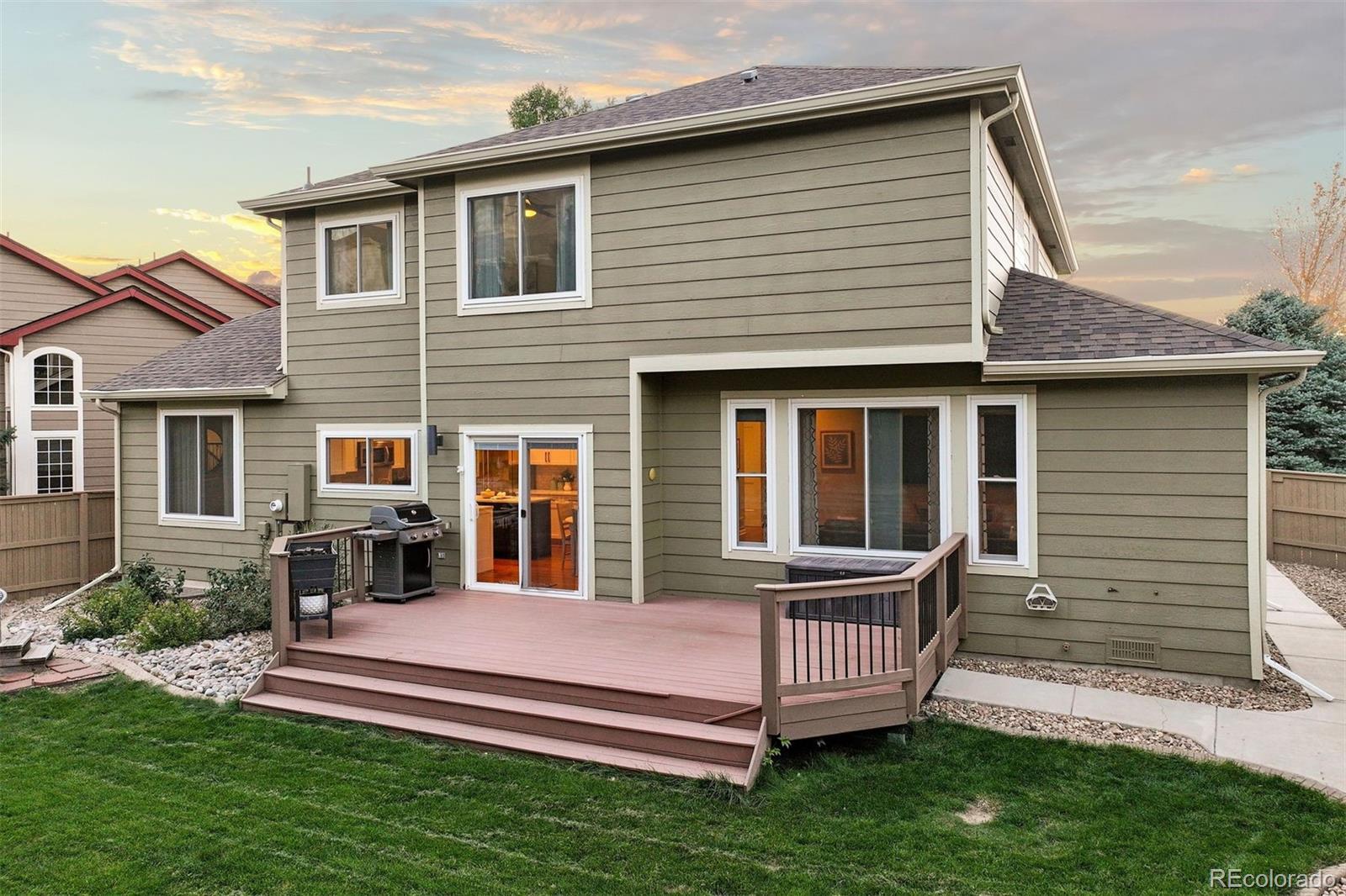 5426 East Knoll Place Highlands Ranch, CO 80130 - Photo 25 of 28 a front view of a house with a yard