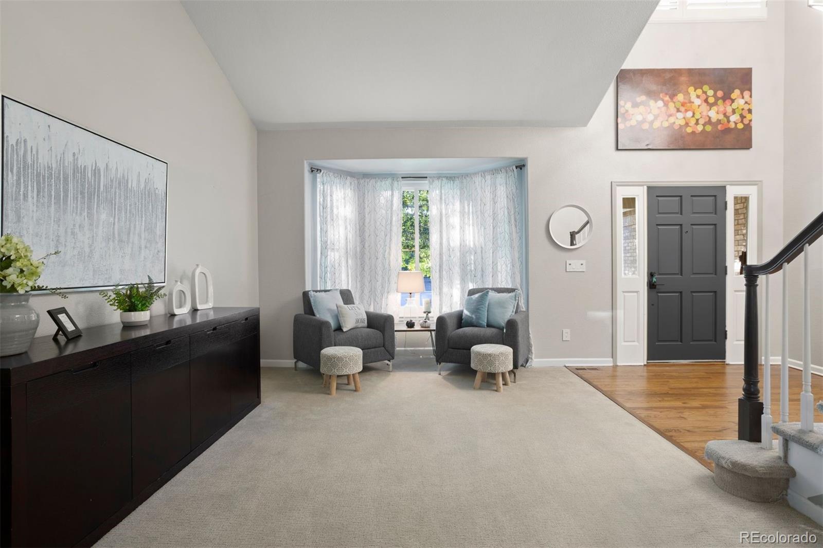 5426 East Knoll Place Highlands Ranch, CO 80130 - Photo 7 of 28 a living room with furniture and a large window