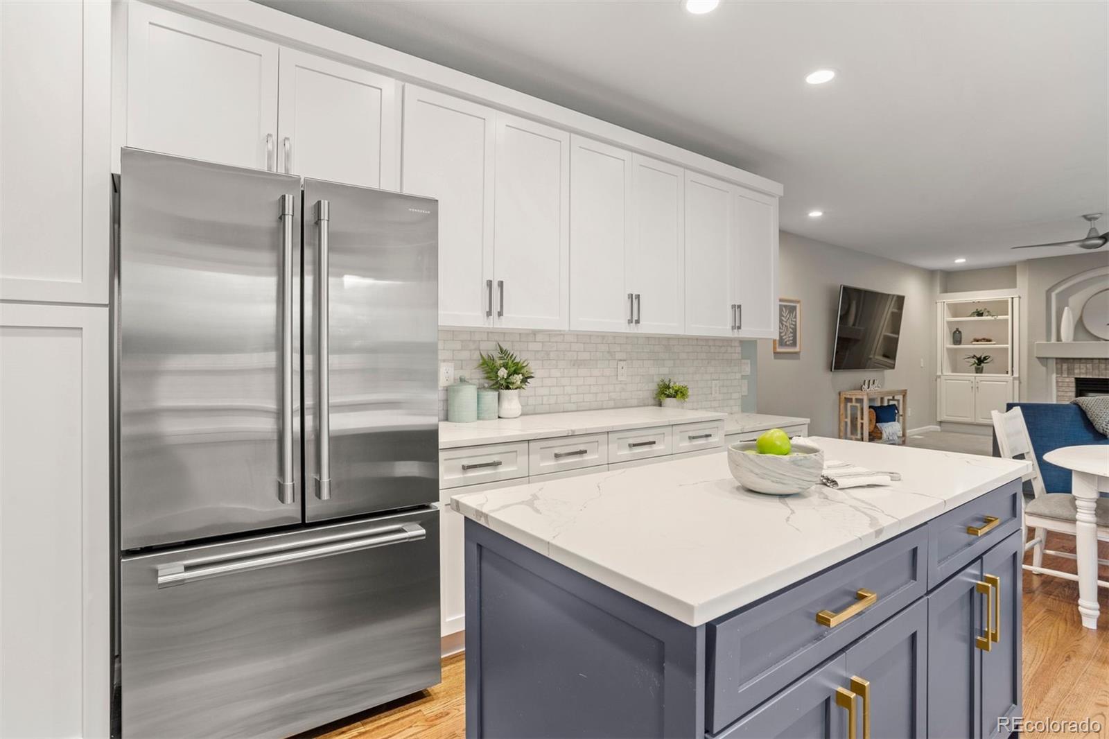 5426 East Knoll Place Highlands Ranch, CO 80130 - Photo 10 of 28 a kitchen with a refrigerator and a sink