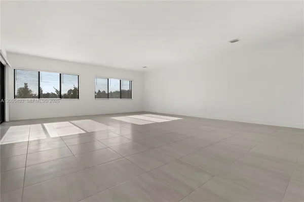 a view of empty room with windows