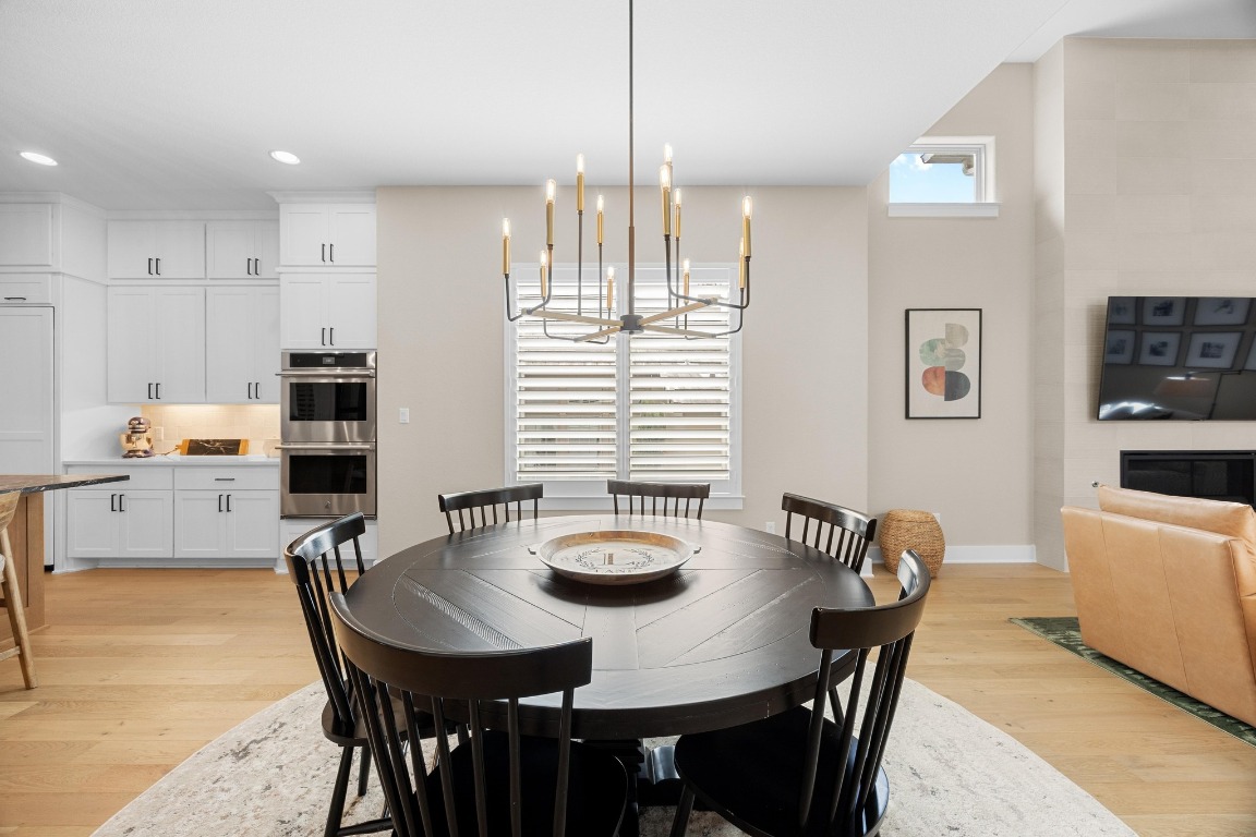 815 Flint Ridge Trail Georgetown, TX 78628 - Photo 12 of 39 a view of a dining room with furniture