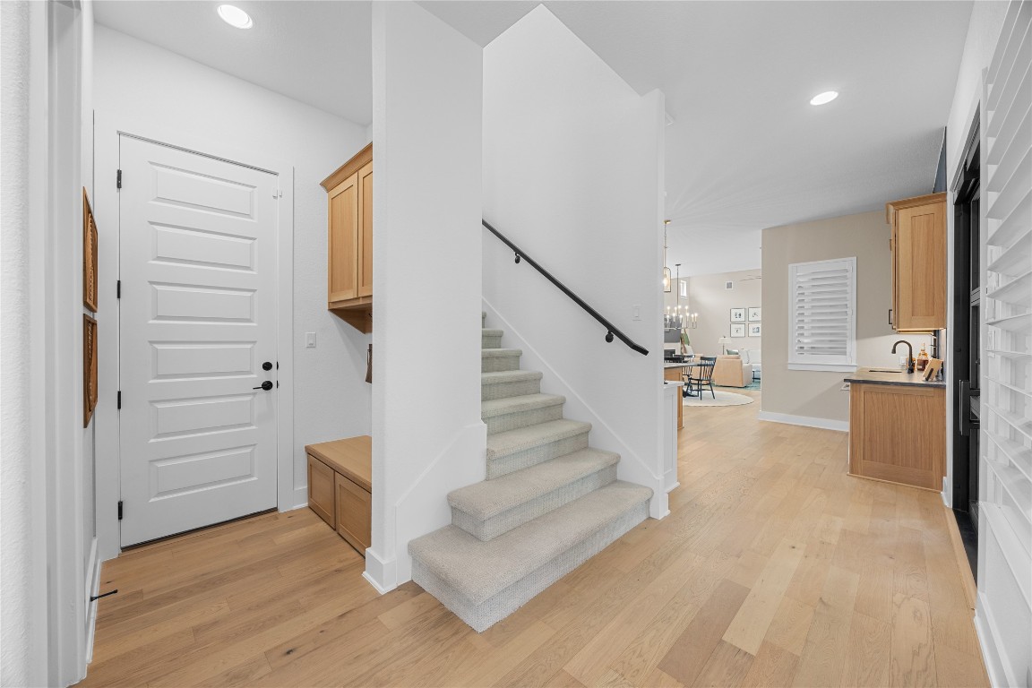 815 Flint Ridge Trail Georgetown, TX 78628 - Photo 14 of 39 a view of entryway and hall with wooden floor