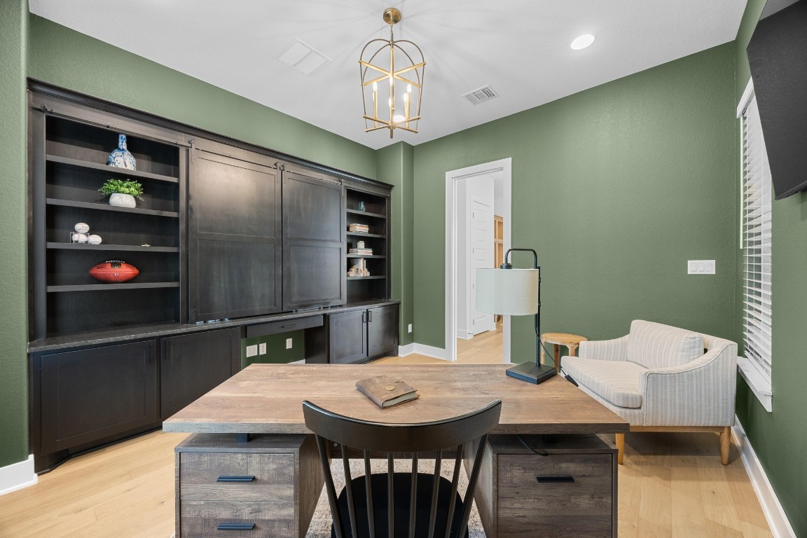815 Flint Ridge Trail Georgetown, TX 78628 - Photo 15 of 39 a kitchen with a table and chairs in it