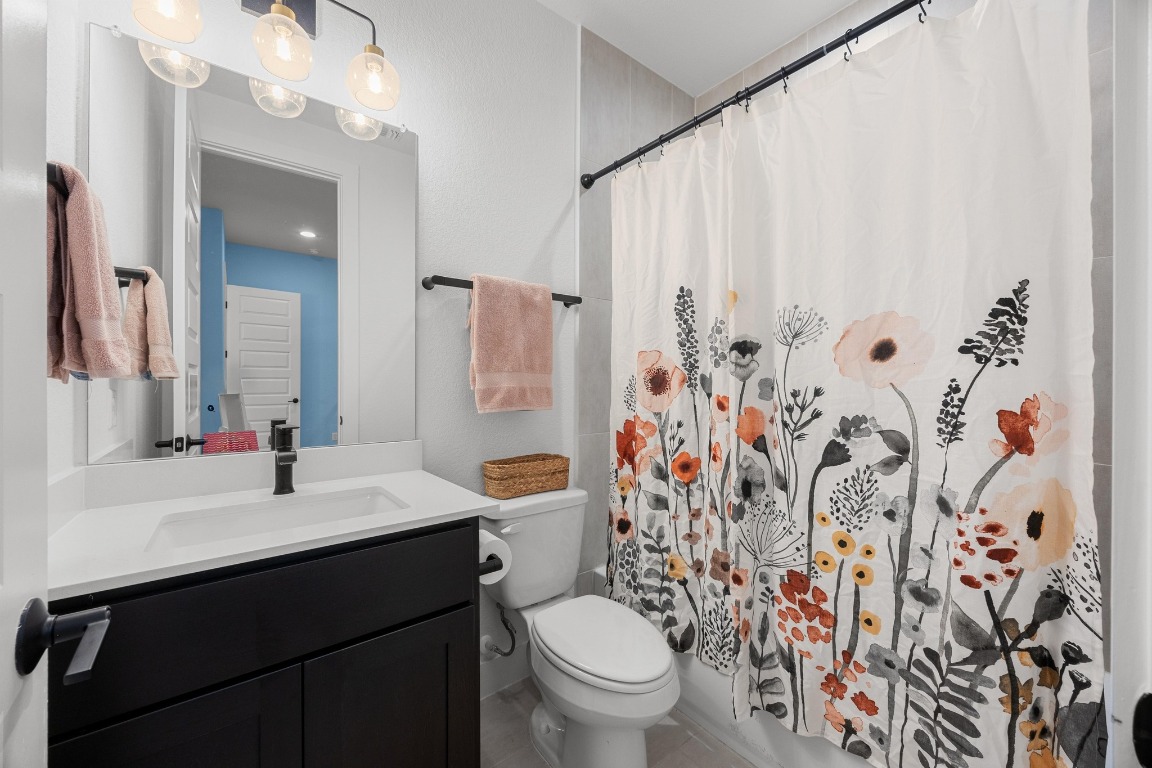 815 Flint Ridge Trail Georgetown, TX 78628 - Photo 21 of 39 a bathroom with a sink and a mirror