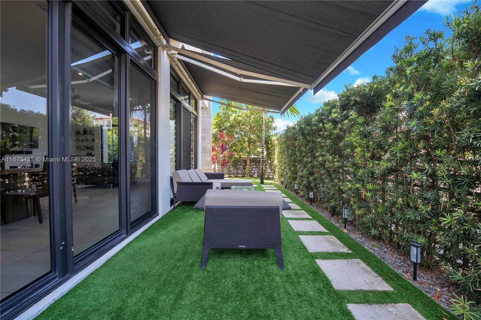 8279 Northwest 43rd Street Doral, FL 33166 - Photo 29 of 56 Side patio.