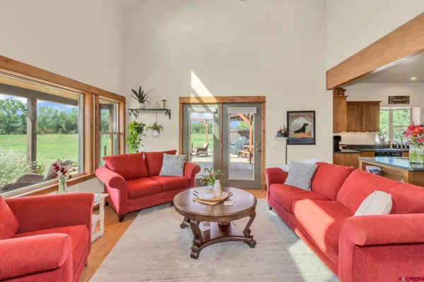 a kitchen with stainless steel appliances granite countertop a kitchen island a stove and a sink