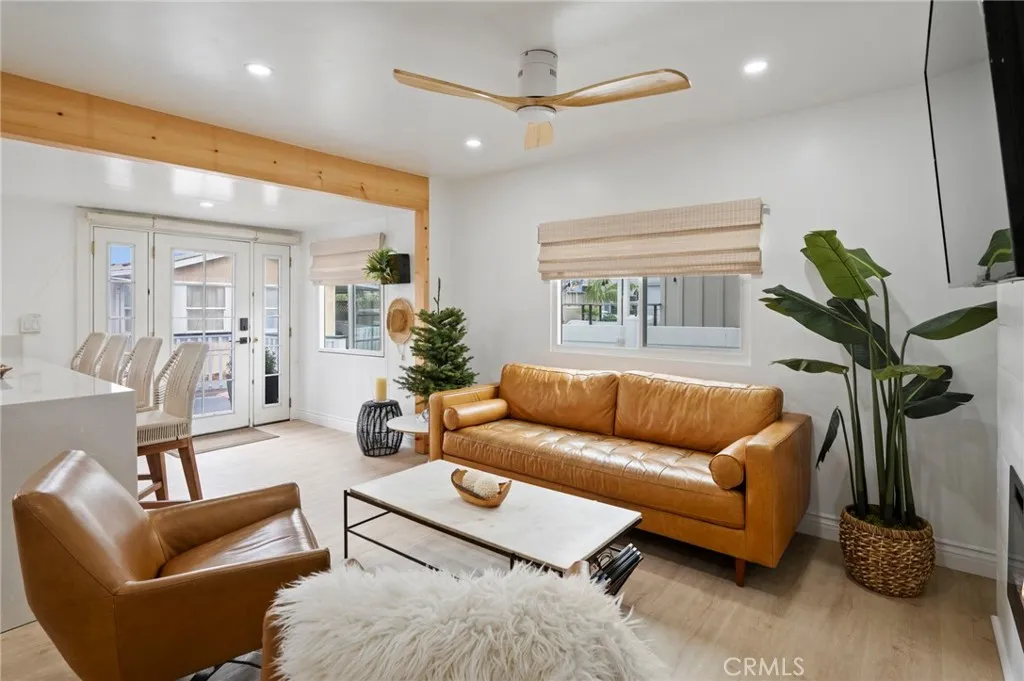 6550 Ponto, Unit 17 Carlsbad, CA 92011 - Photo 13 of 48 a living room with furniture a window and a chandelier
