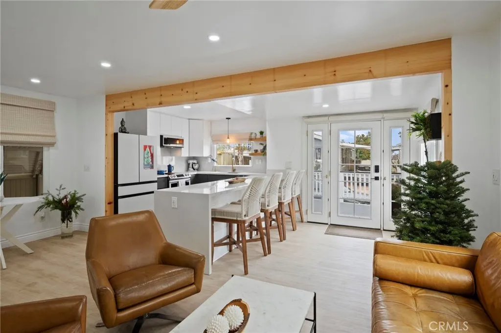 6550 Ponto, Unit 17 Carlsbad, CA 92011 - Photo 14 of 48 a dining room with furniture and a floor to ceiling window