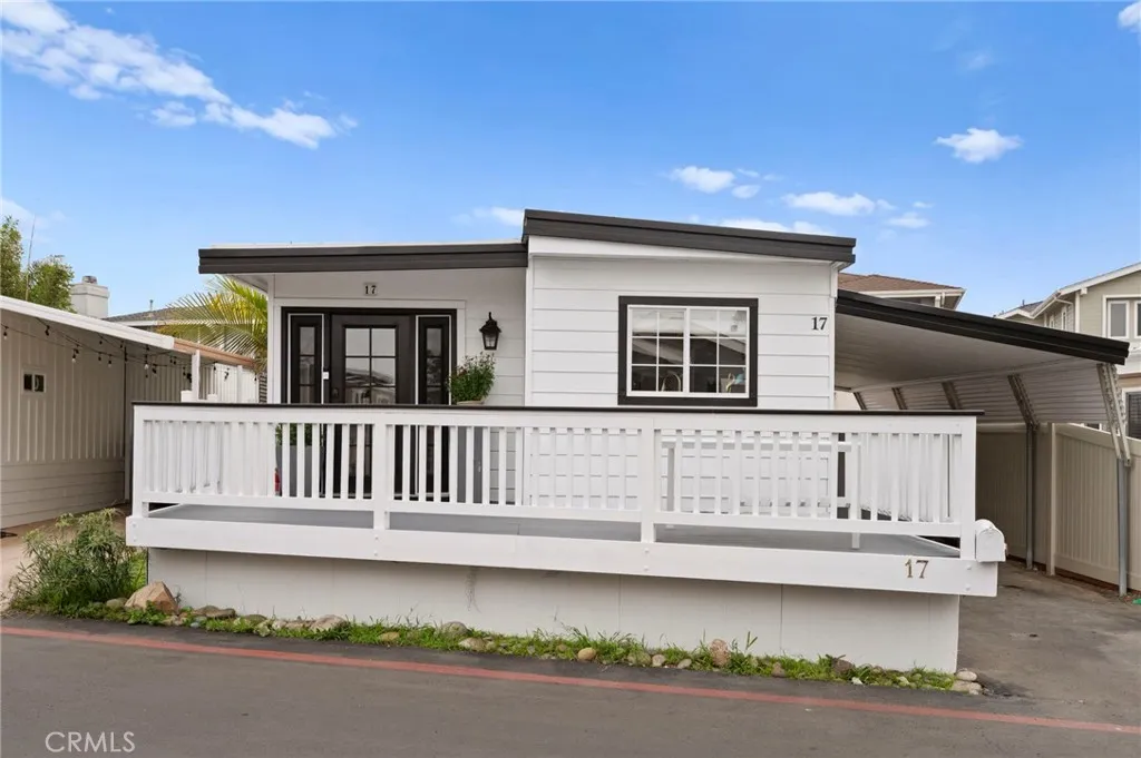 6550 Ponto, Unit 17 Carlsbad, CA 92011 - Photo 2 of 48 a front view of a house with garage