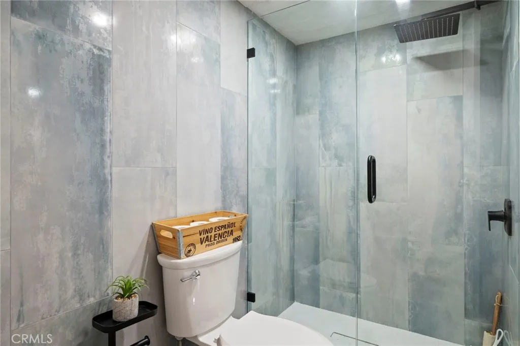 6550 Ponto, Unit 17 Carlsbad, CA 92011 - Photo 25 of 48 a bathroom with a toilet and shower