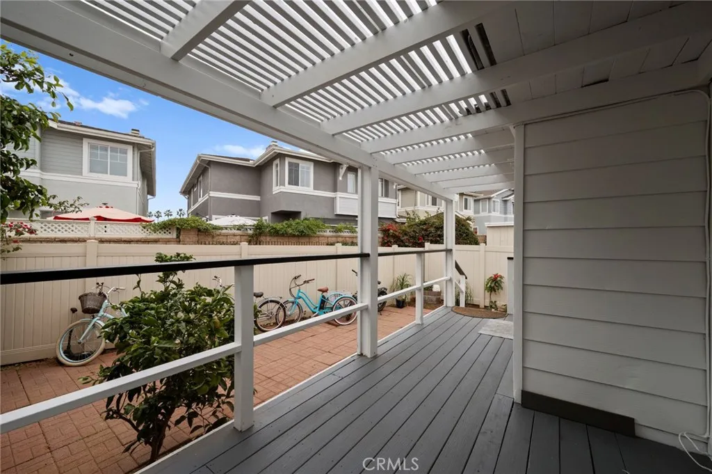 6550 Ponto, Unit 17 Carlsbad, CA 92011 - Photo 30 of 48 a view of a porch with wooden floor