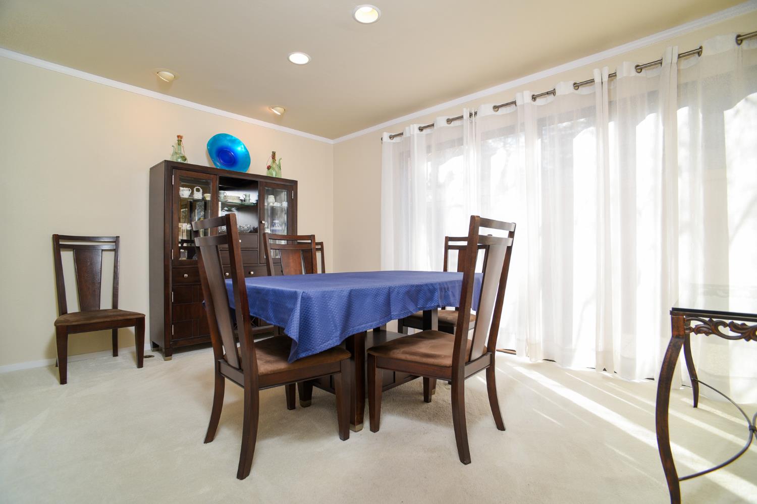 151 Hartnell Place Sacramento, CA 95825 - Photo 11 of 35 a view of a dining room with furniture and a chandelier
