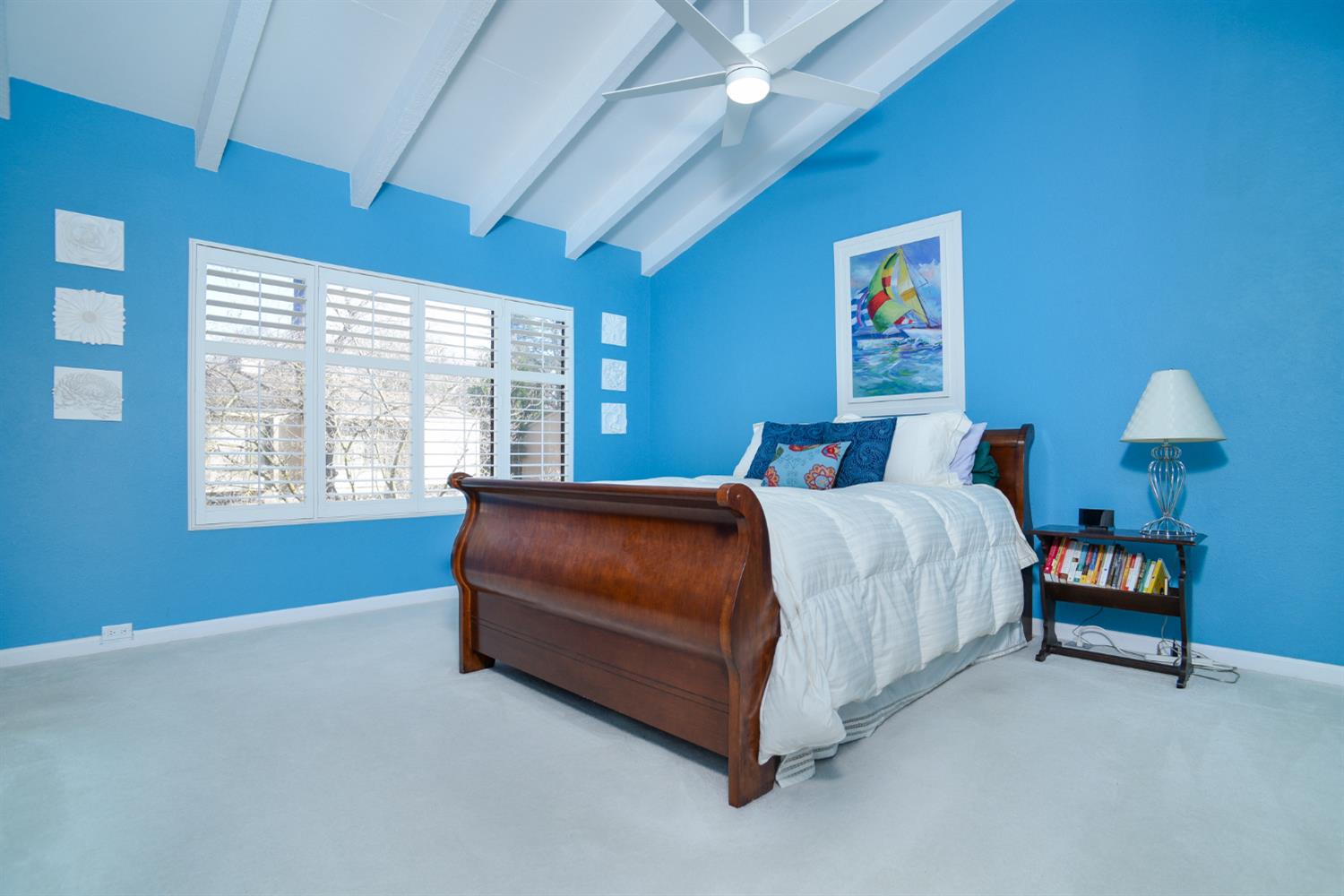 151 Hartnell Place Sacramento, CA 95825 - Photo 16 of 35 a bedroom with a bed lamp and a large window