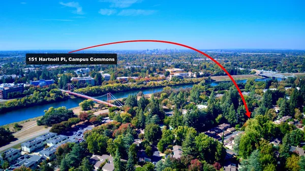 an aerial view of a house with yard