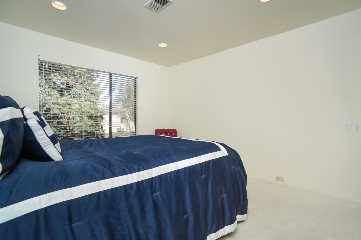 151 Hartnell Place Sacramento, CA 95825 - Photo 22 of 35 a bedroom with a bed and a window