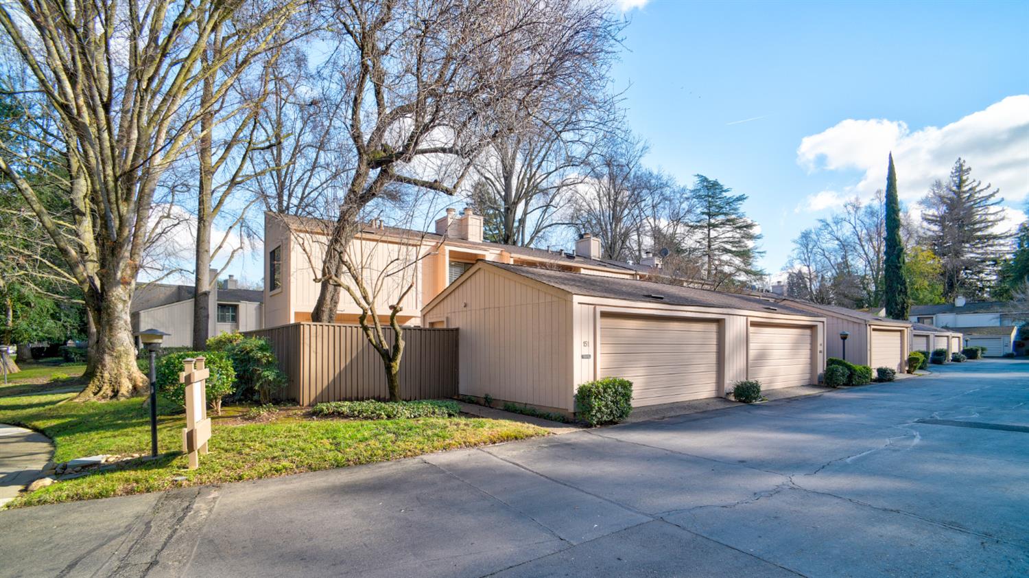 151 Hartnell Place Sacramento, CA 95825 - Photo 27 of 35 a view of a house with a yard and large trees
