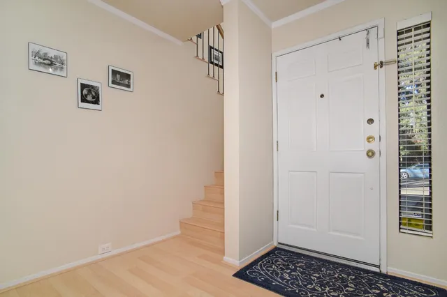 a bedroom with furniture and a flat screen tv