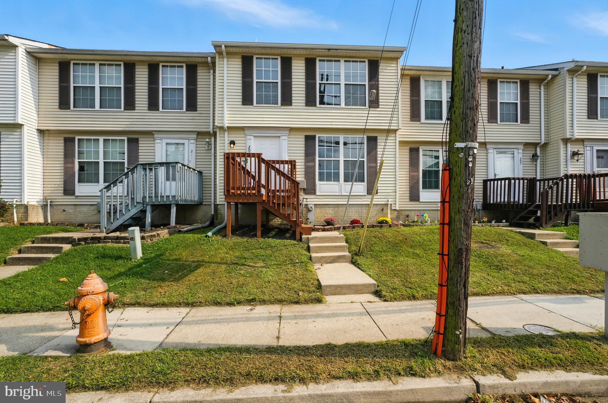 209 Magnolia Terrace Baltimore, MD 21221 - Photo 1 of 50 front view of house with a yard