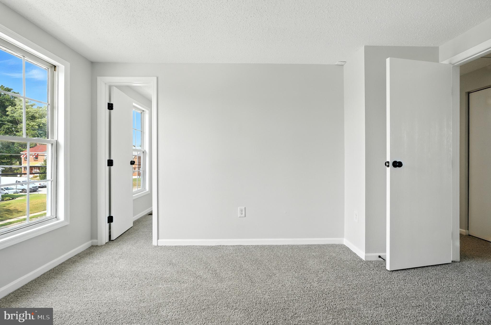 209 Magnolia Terrace Baltimore, MD 21221 - Photo 15 of 50 an empty room with windows