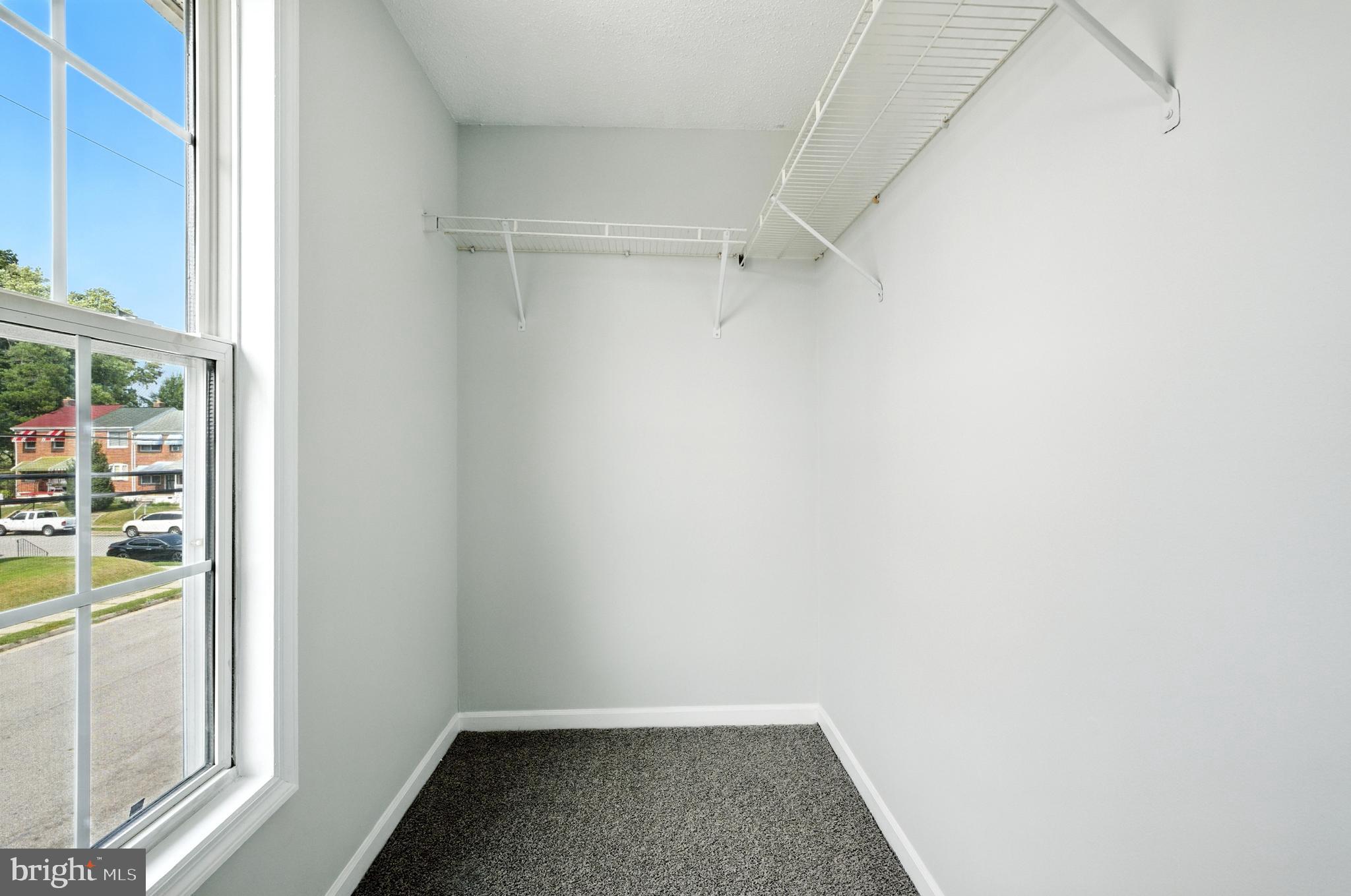 209 Magnolia Terrace Baltimore, MD 21221 - Photo 16 of 50 a view of a room with racks on the wall
