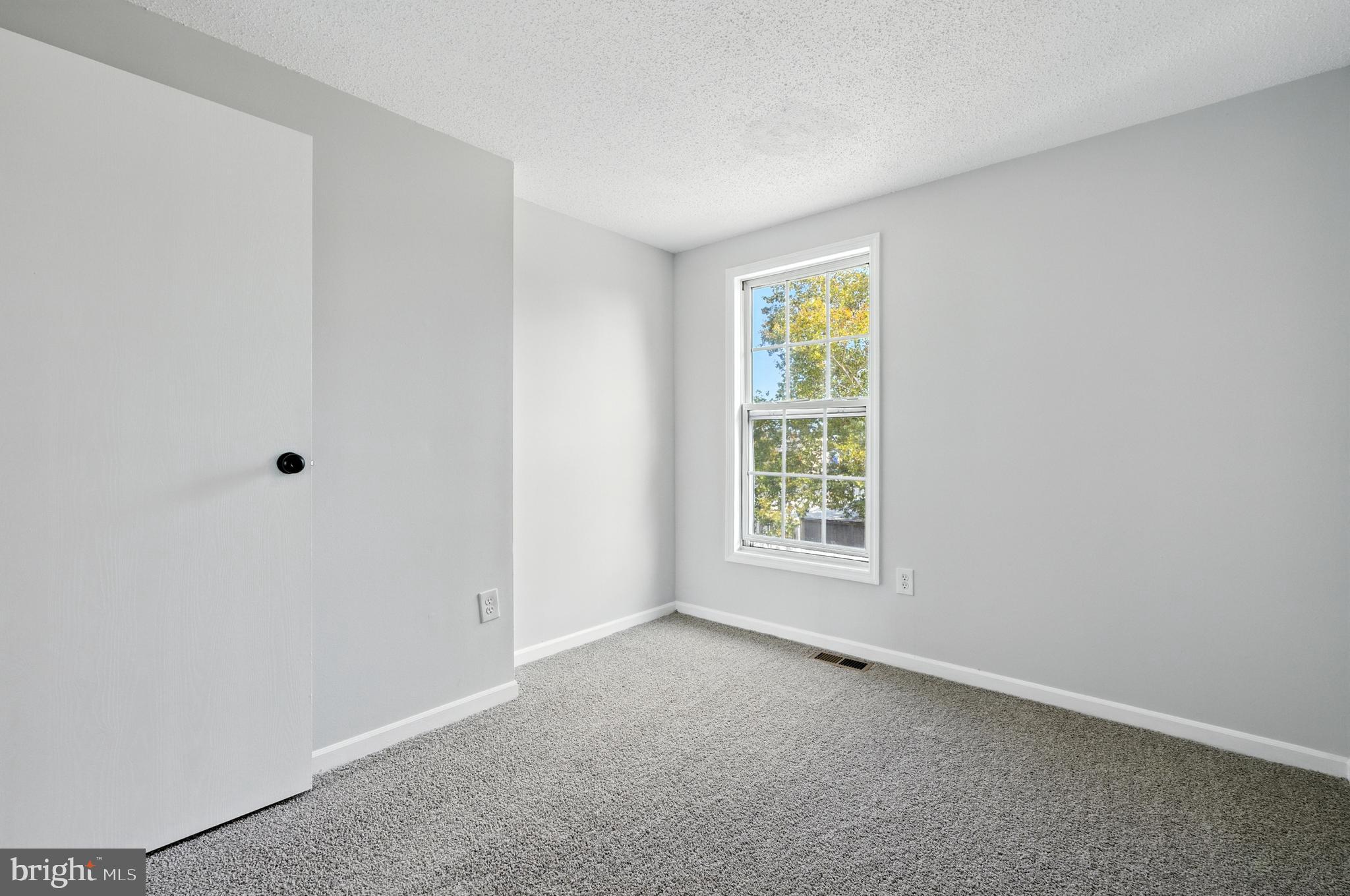 209 Magnolia Terrace Baltimore, MD 21221 - Photo 19 of 50 a view of an empty room with a window