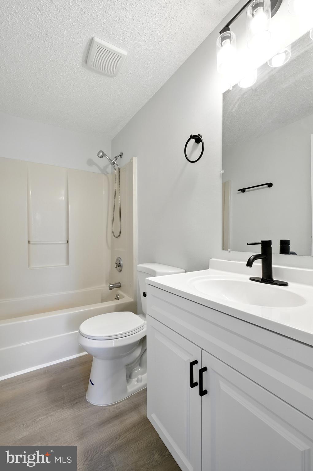 209 Magnolia Terrace Baltimore, MD 21221 - Photo 22 of 50 a bathroom with a sink a toilet and a bathtub