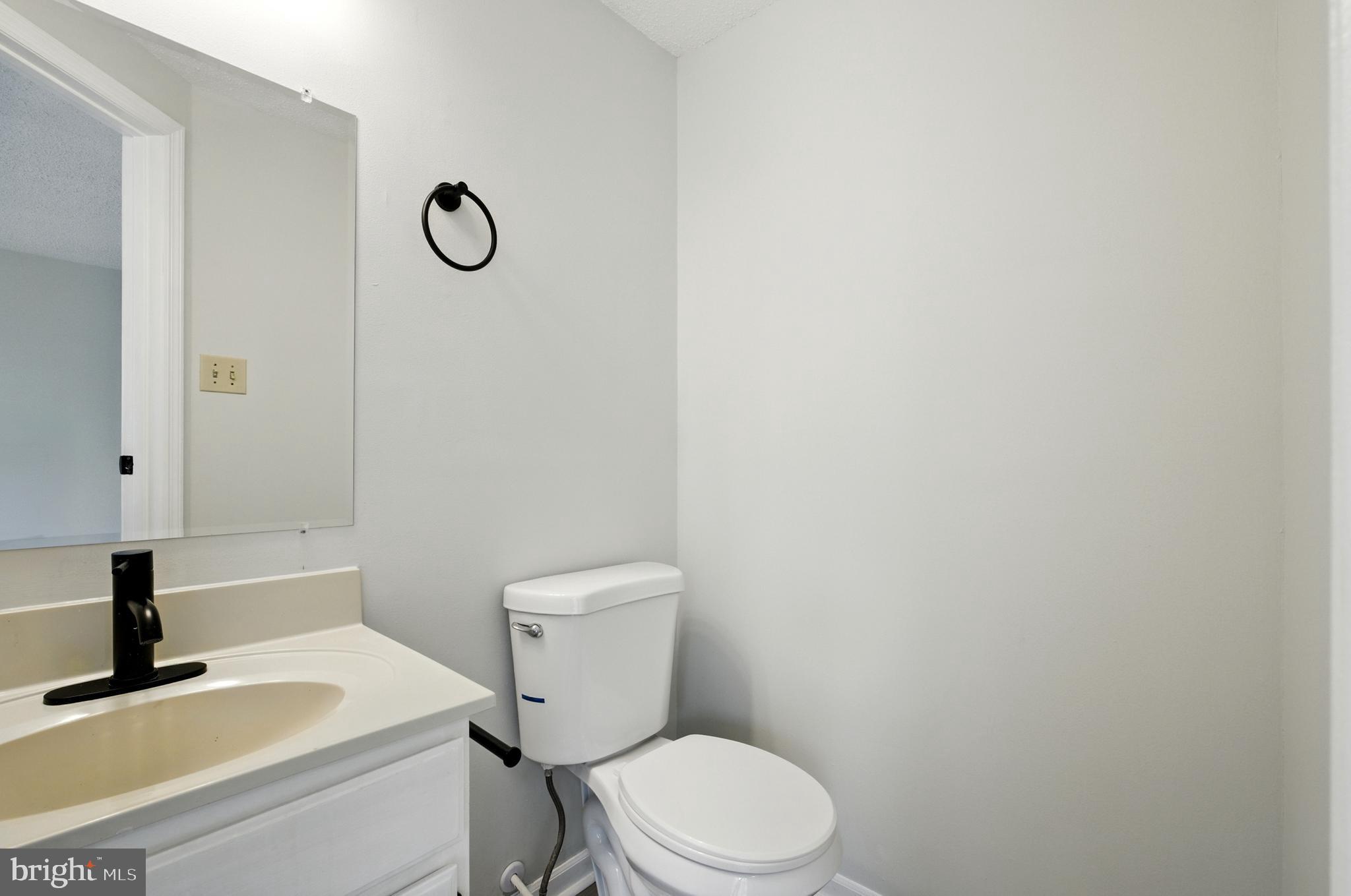 209 Magnolia Terrace Baltimore, MD 21221 - Photo 26 of 50 a white toilet sitting next to a bathroom sink