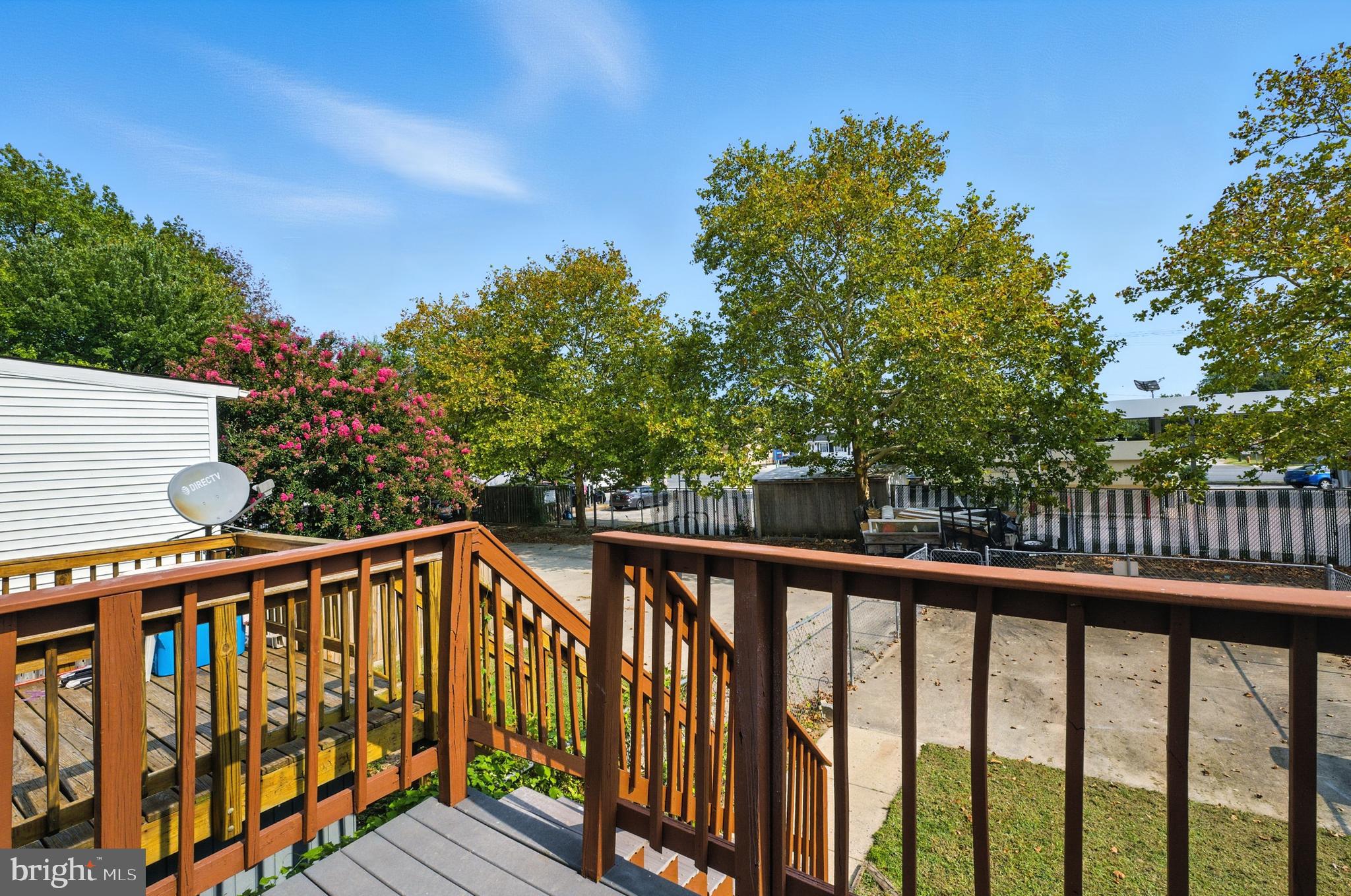 209 Magnolia Terrace Baltimore, MD 21221 - Photo 35 of 50 a view of balcony with wooden floor and fence