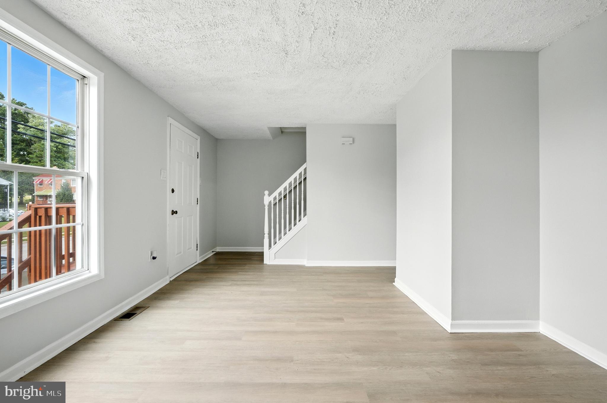 209 Magnolia Terrace Baltimore, MD 21221 - Photo 4 of 50 a view of an empty room with windows