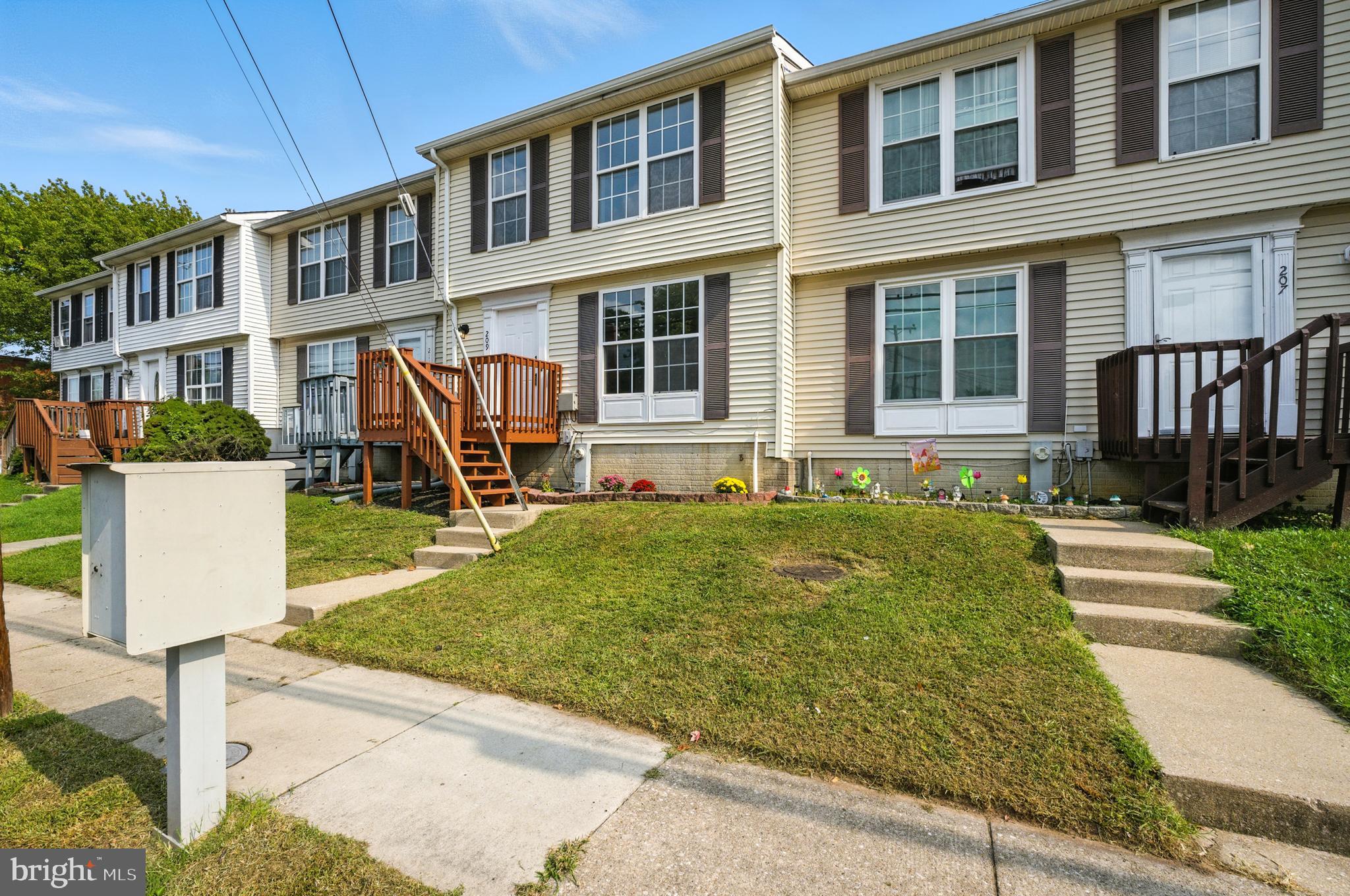 209 Magnolia Terrace Baltimore, MD 21221 - Photo 45 of 50 front view of a house with a yard