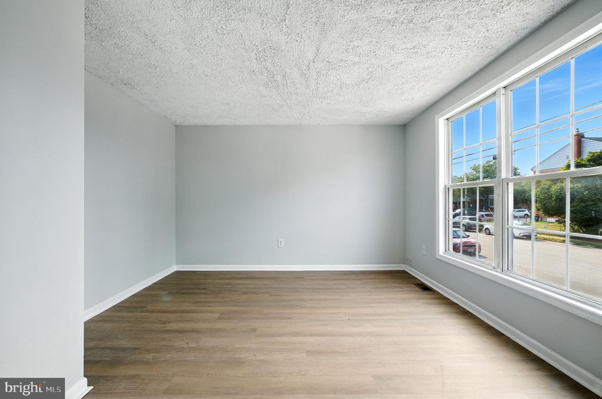 209 Magnolia Terrace Baltimore, MD 21221 - Photo 6 of 50 a view of an empty room with a window