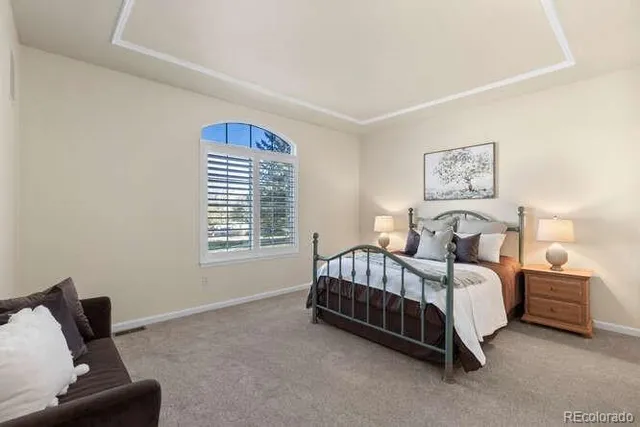 a bed room with a bed and a couch