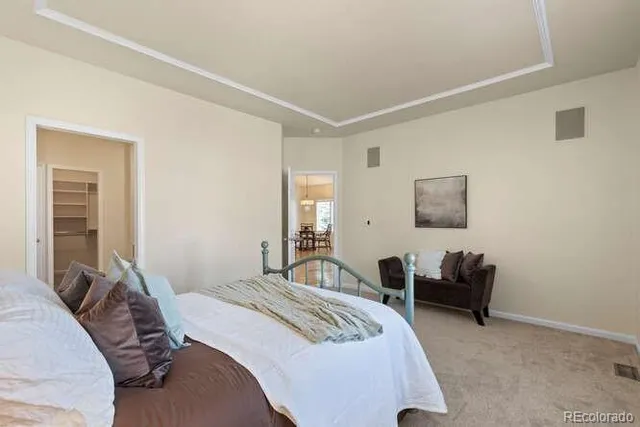 a bedroom with bed and a couch