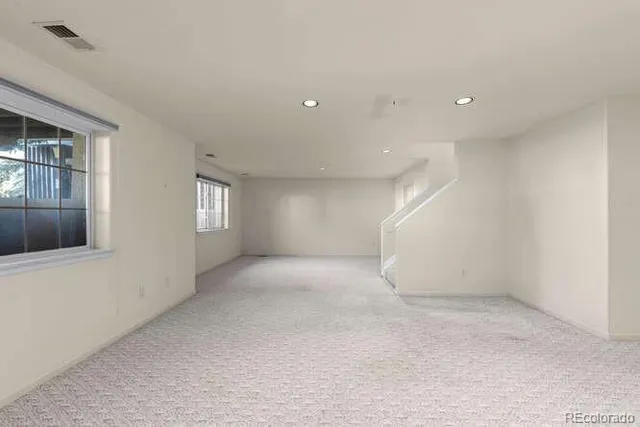 an empty room with windows