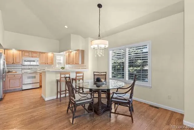 a dining room with furniture window wooden floor