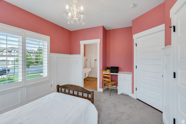 1355 West 1000 South Mapleton, UT 84664 - Photo 27 of 74 Bedroom with a wainscoted wall, a decorative wall, ensuite bathroom, light colored carpet, and a chandelier