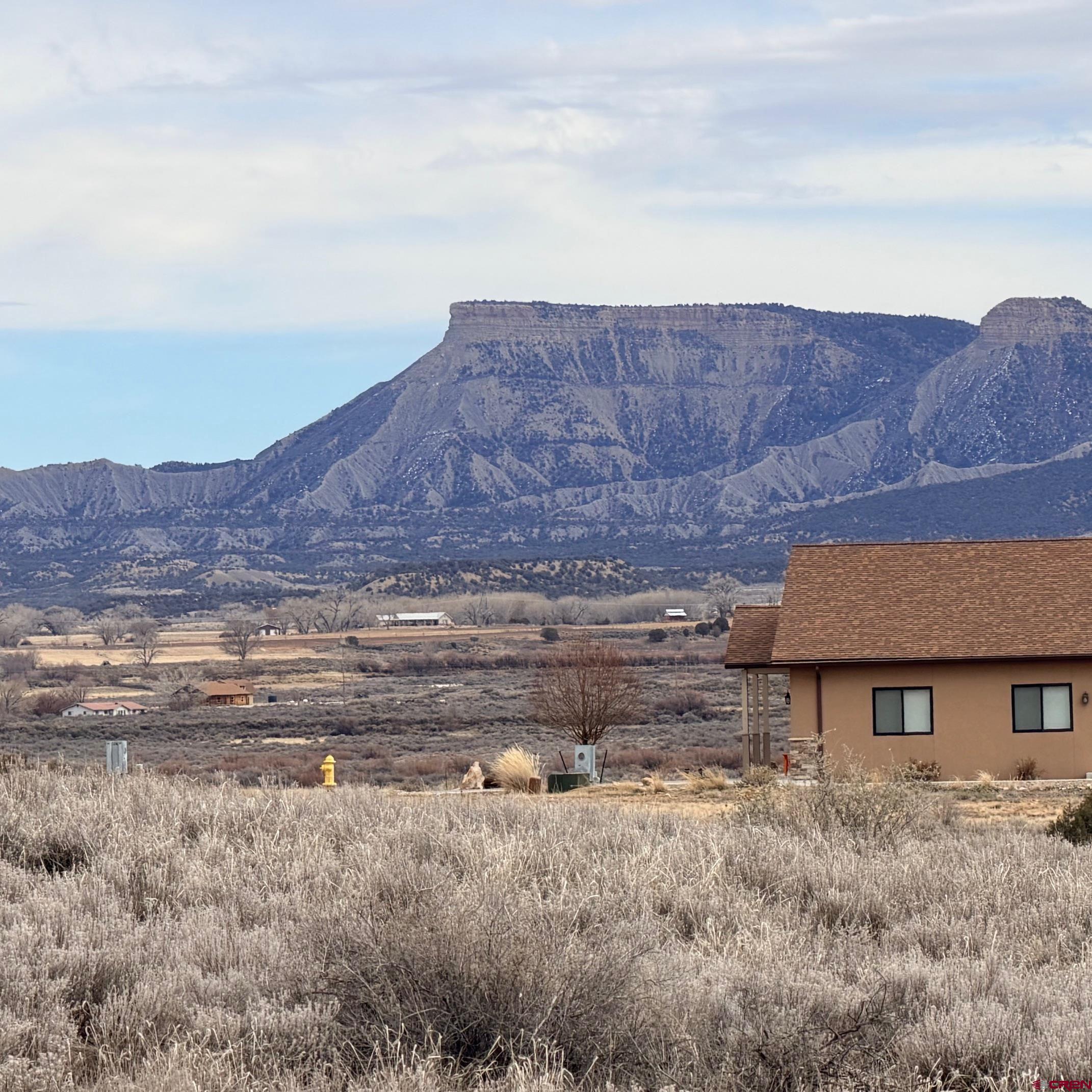 Lot 129 Nicholette Way Cortez, CO 81321 - Photo 25 of 30 a view of a house with a yard