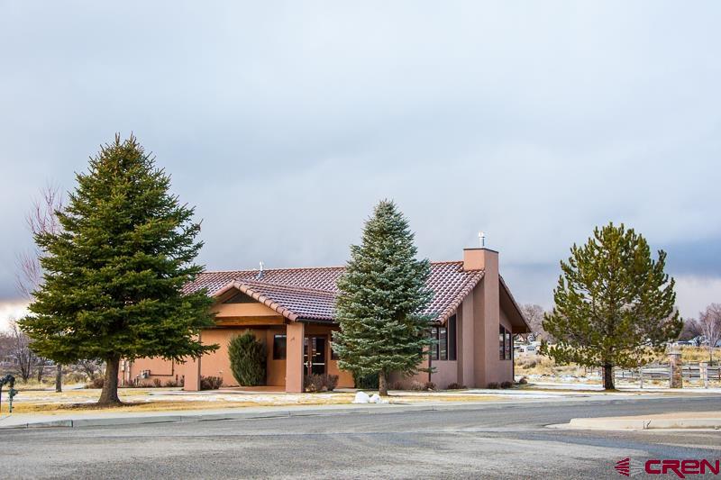 Lot 129 Nicholette Way Cortez, CO 81321 - Photo 3 of 30 a view of a house with a garden
