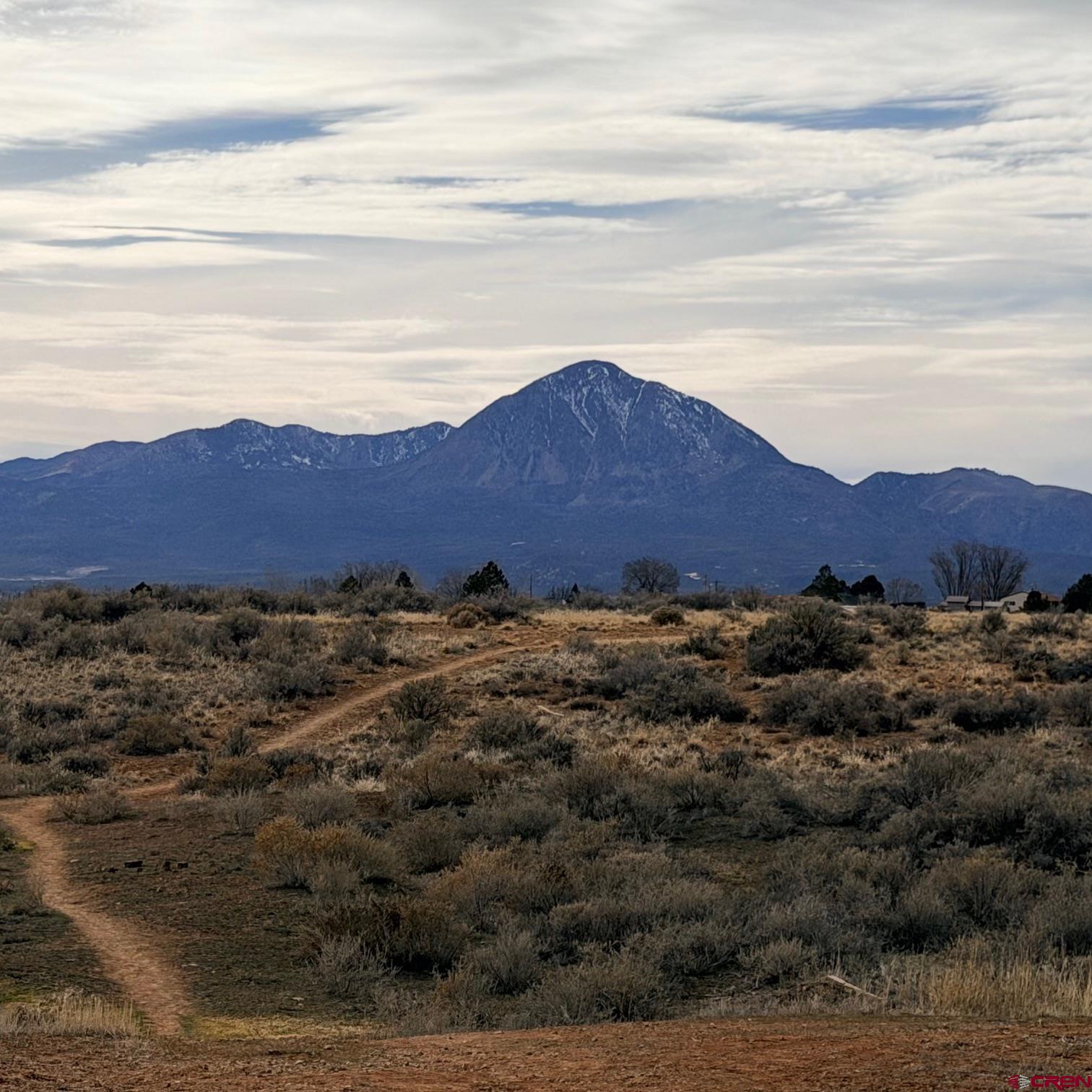 Lot 129 Nicholette Way Cortez, CO 81321 - Photo 6 of 30 a view of a lush green hillside and houses