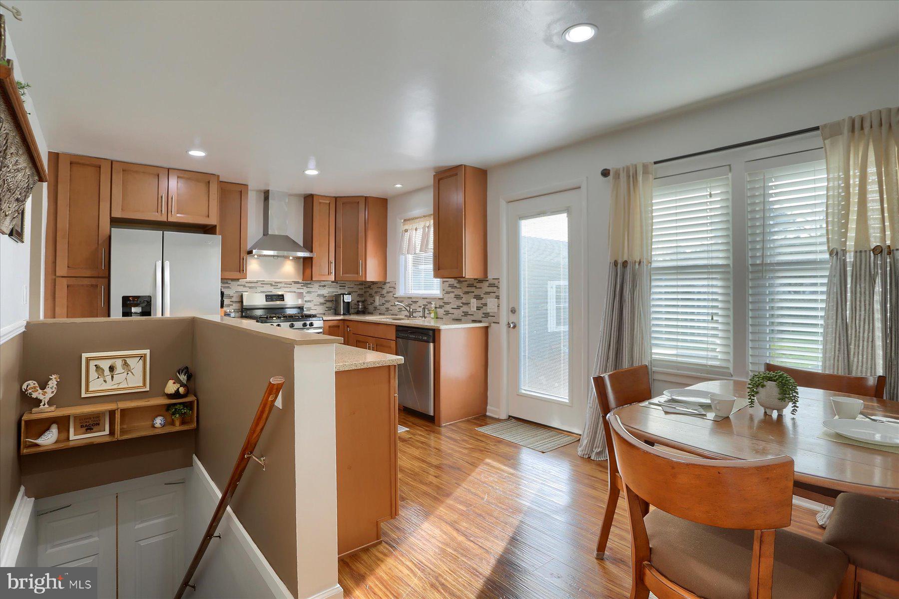 1181 Kingsley Road Camp Hill, PA 17011 - Photo 11 of 40 a kitchen with a table chairs refrigerator and cabinets