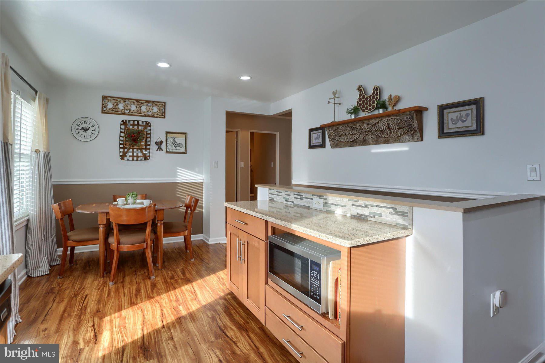 1181 Kingsley Road Camp Hill, PA 17011 - Photo 13 of 40 a living room with stainless steel appliances granite countertop furniture and a wooden floor