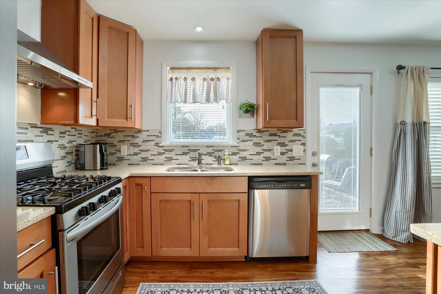1181 Kingsley Road Camp Hill, PA 17011 - Photo 14 of 40 a kitchen with stainless steel appliances granite countertop a stove a sink and a microwave