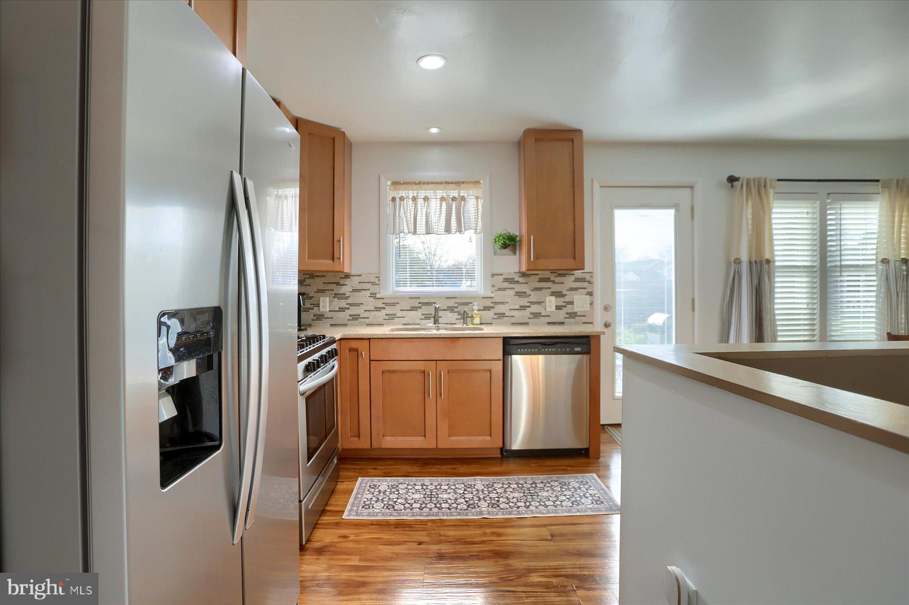 1181 Kingsley Road Camp Hill, PA 17011 - Photo 15 of 40 a kitchen with stainless steel appliances granite countertop a refrigerator and a sink
