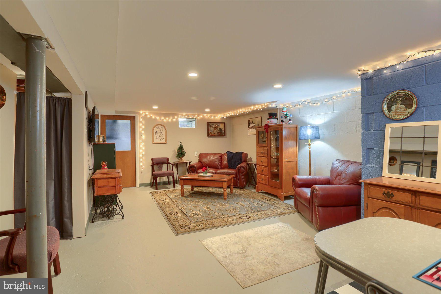 1181 Kingsley Road Camp Hill, PA 17011 - Photo 27 of 40 a living room with furniture and a clock