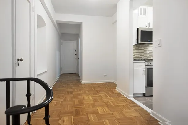 a kitchen with a sink and stainless steel appliances