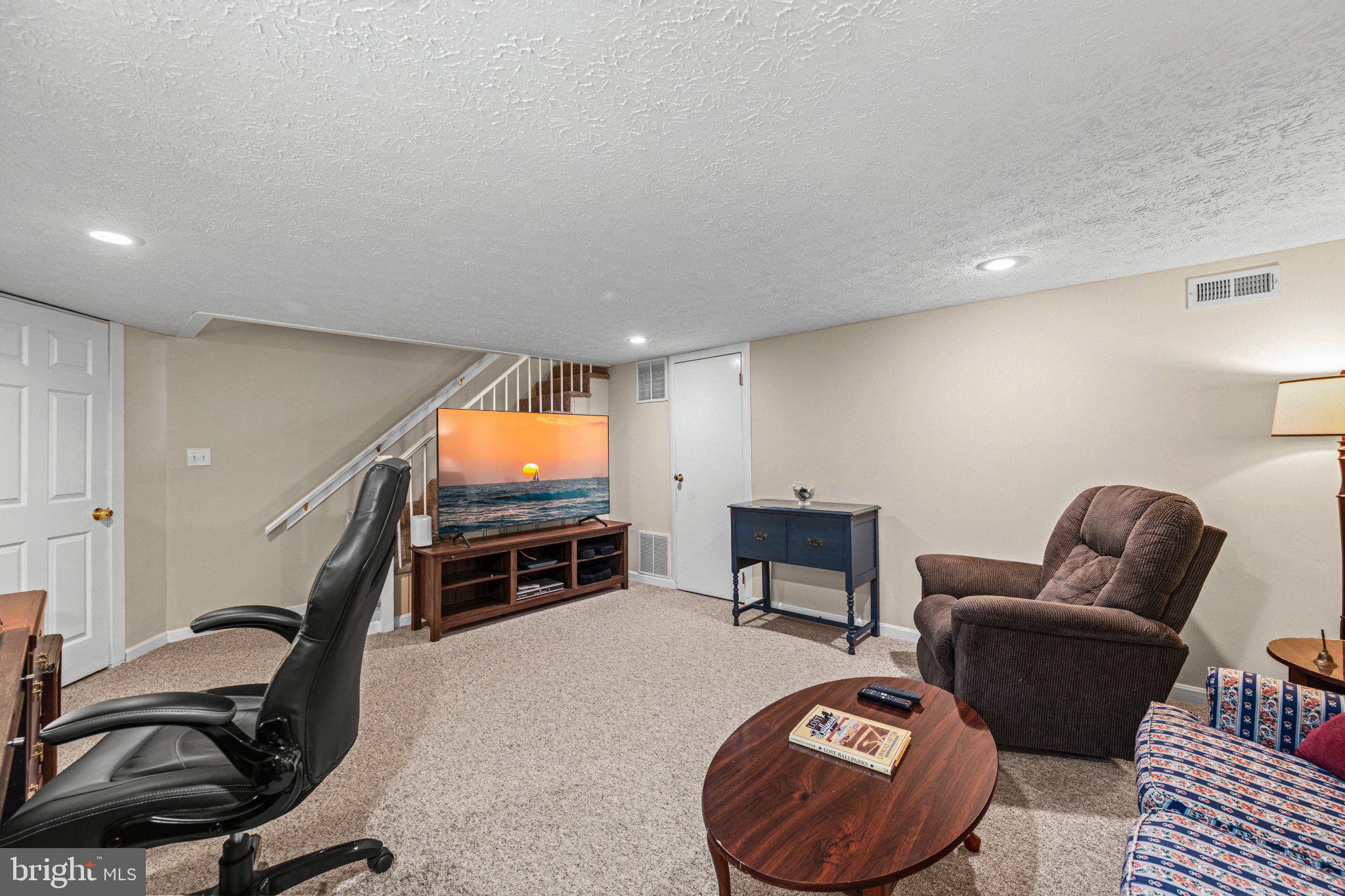 406 Greenlow Road Baltimore, MD 21228 - Photo 24 of 31 Cozy basement retreat for relaxation.