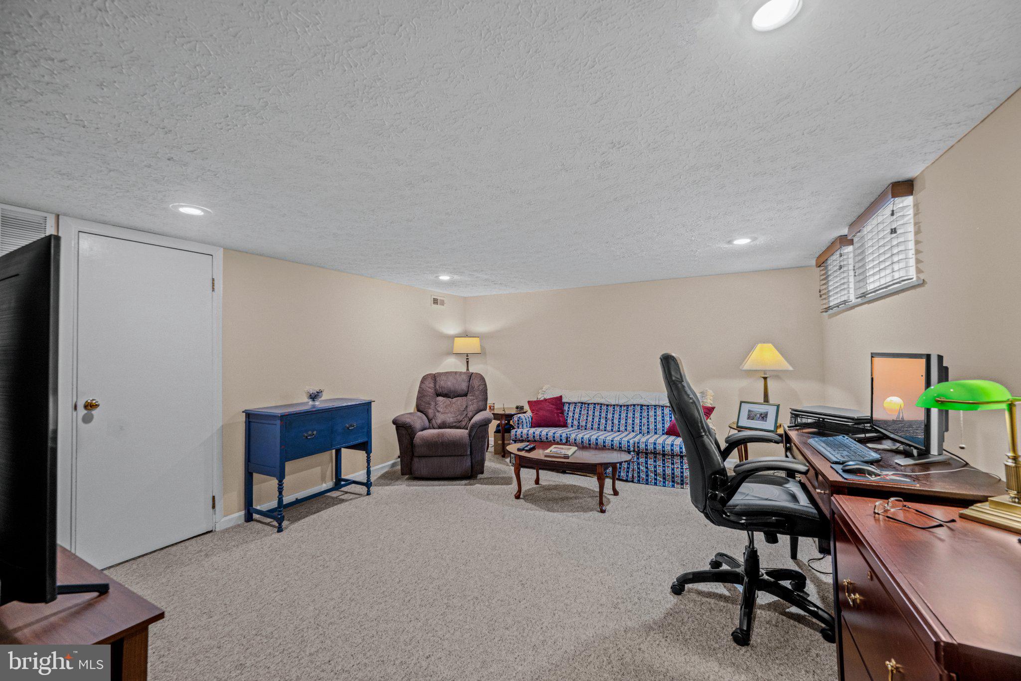 406 Greenlow Road Baltimore, MD 21228 - Photo 26 of 31 Cozy basement retreat with natural light.