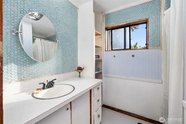 a bathroom with a sink and a mirror