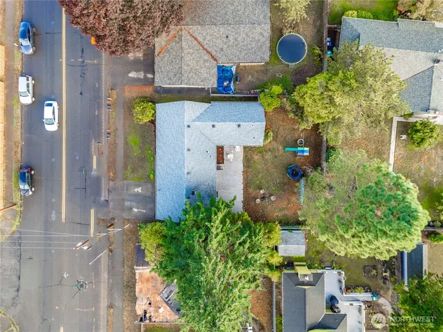 an aerial view of a house with a yard